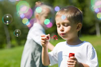 Child blowing bubbles